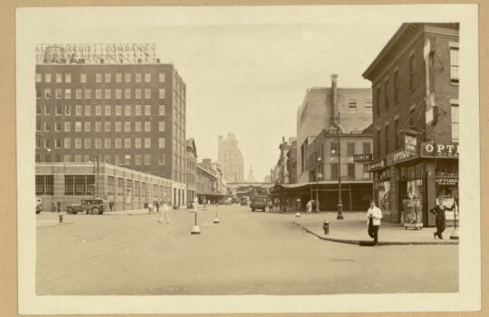 A historical image of 14th street with buildings and pedestrians