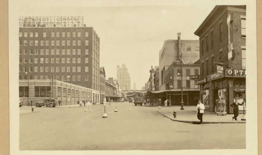 A historical image of 14th street with buildings and pedestrians
